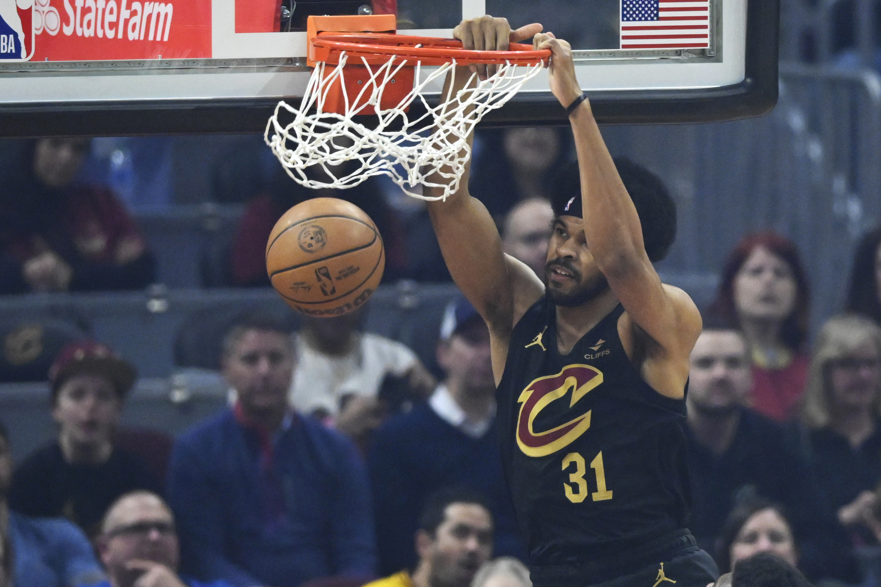 Mar 20, 2024; Cleveland, Ohio, USA; Cleveland Cavaliers center Jarrett Allen (31) dunks in the first quarter against the Miami Heat at Rocket Mortgage FieldHouse.