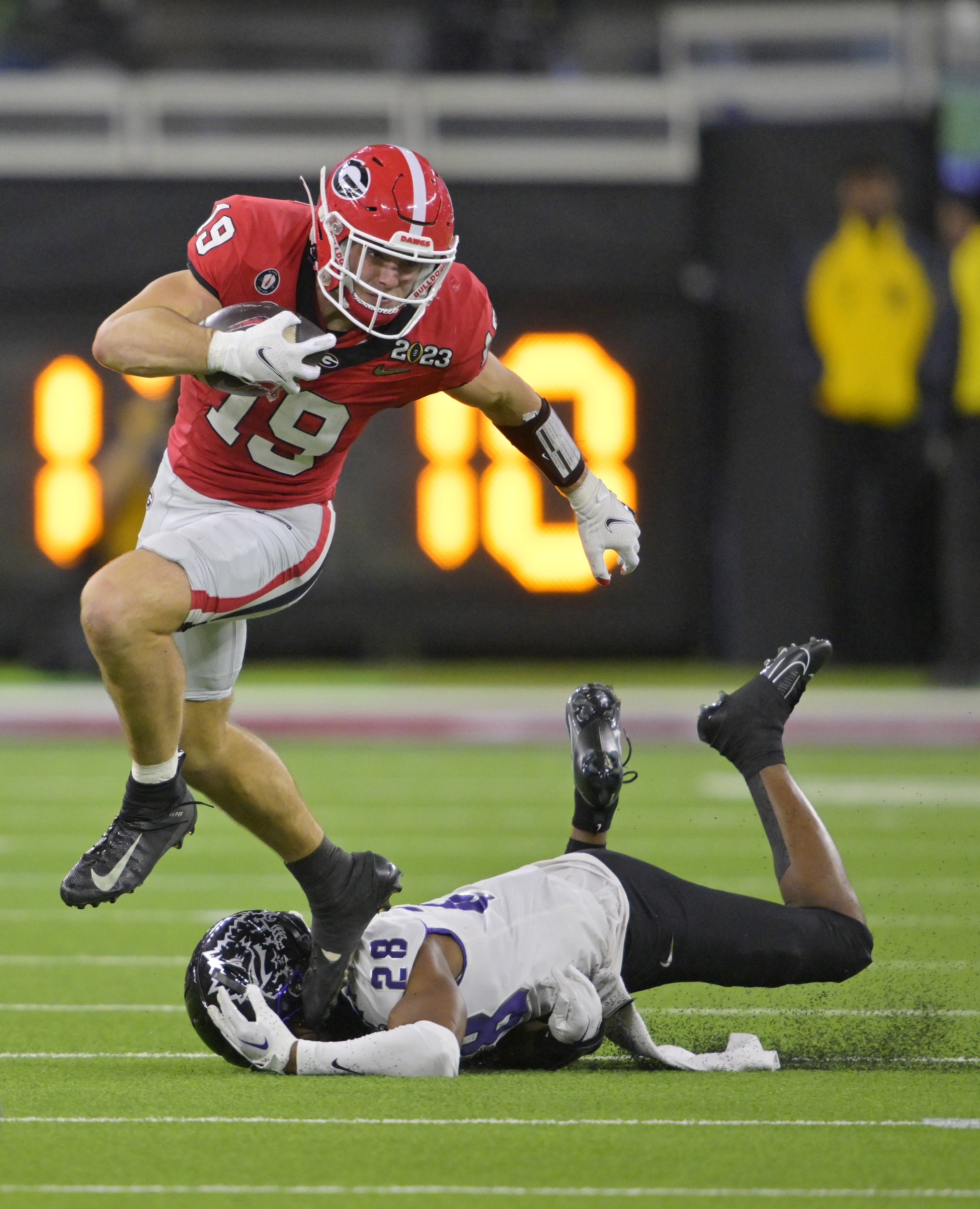 Georgia Bulldogs tight end Brock Bowers (19) gets past TCU Horned Frogs safety Millard Bradford (28) during the CFP national championship game. Mandatory Credit: Jayne Kamin-Oncea-USA TODAY Sports