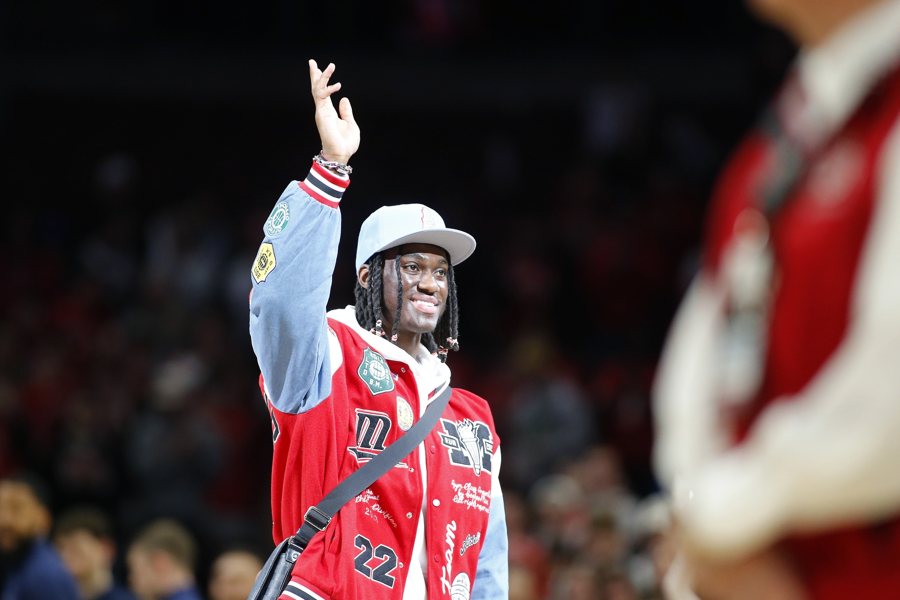 Jan 20, 2024; Columbus, Ohio, USA; Ohio State Buckeyes wide receiver Marvin Harrison Jr. is honored at center court during the first half of the game between the Ohio State Buckeyes and the Penn State Nittany Lions at Value City Arena.