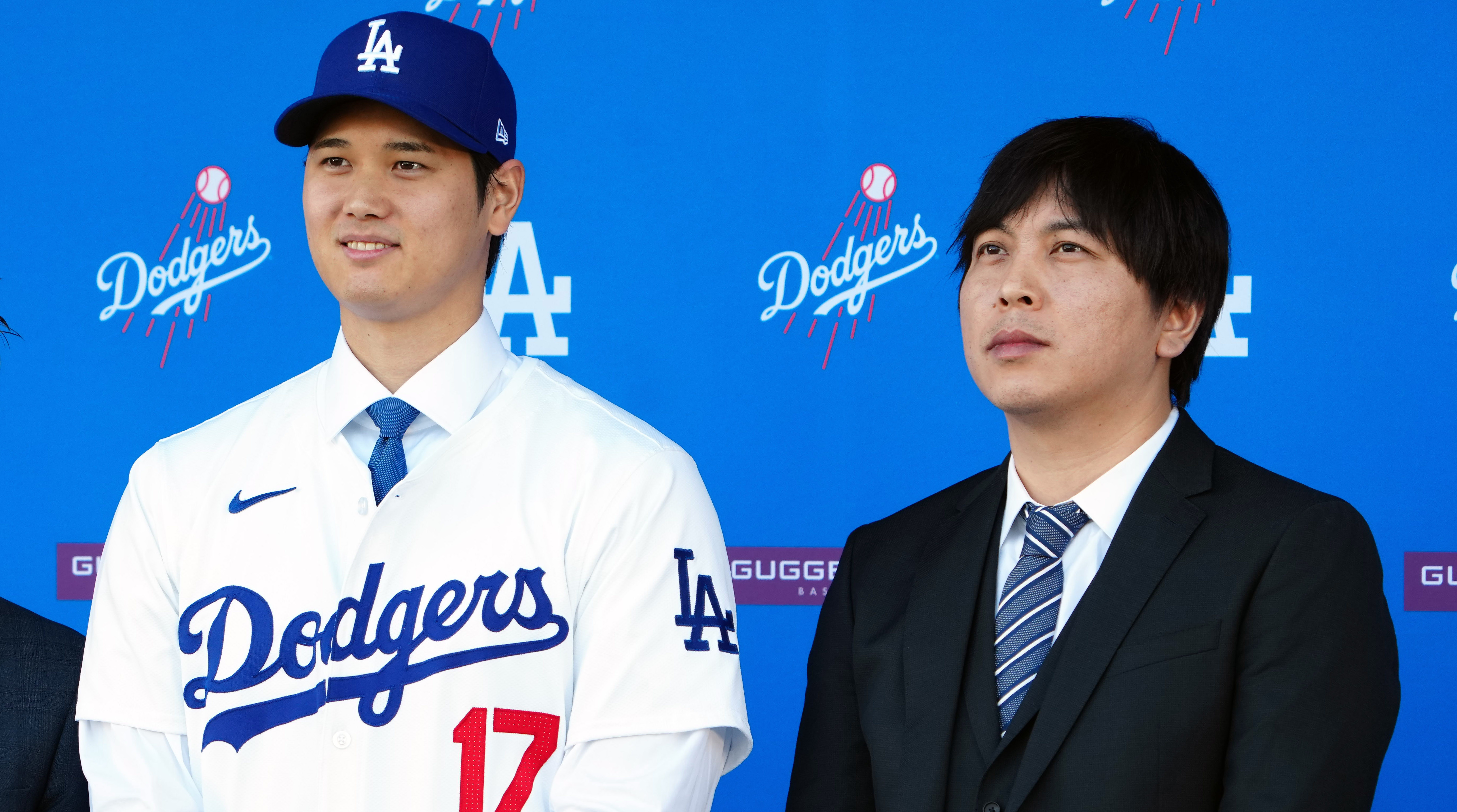 Shohei Ohtani, left, with his translator Ippei Mizuhara at an introductory press conference for the Dodgers