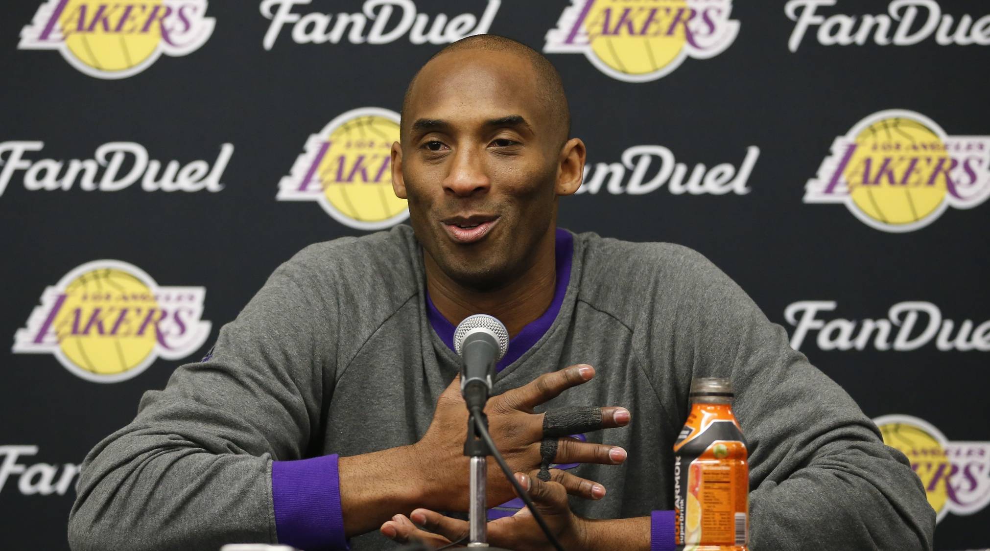 Former Lakers guard Kobe Bryant speaks with media at a press conference.