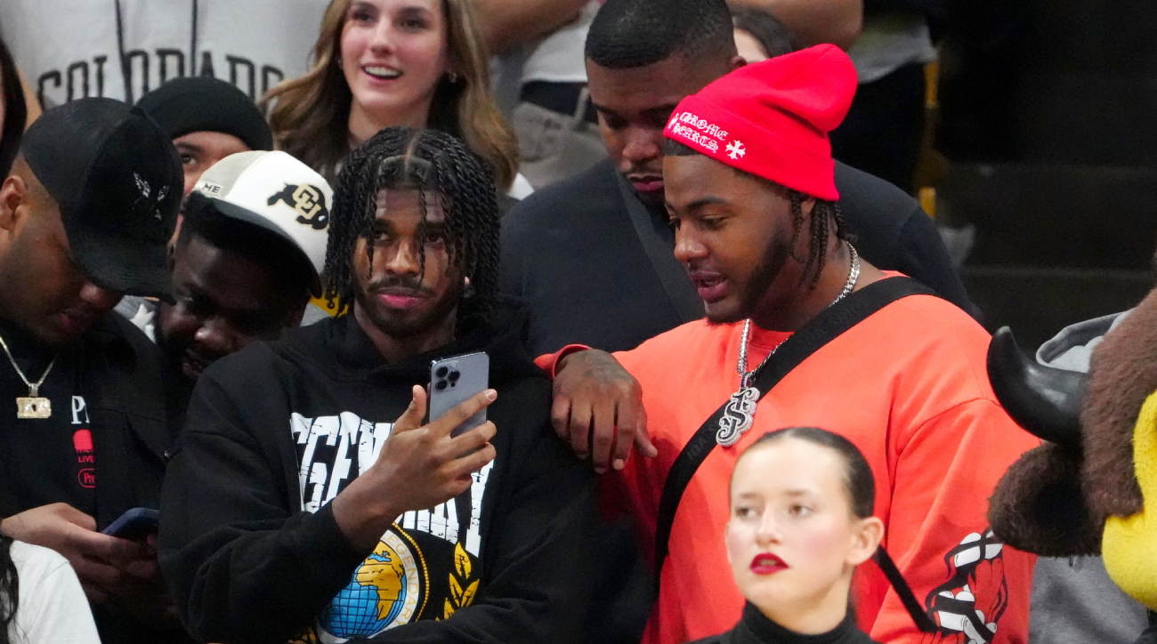 Colorado football stars Shedeur Sanders and Jordan Seaton attend a Buffaloes basketball game.