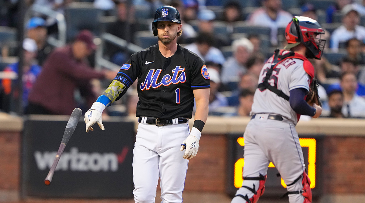 Mets’ Jeff McNeil tosses bat away after striking out.