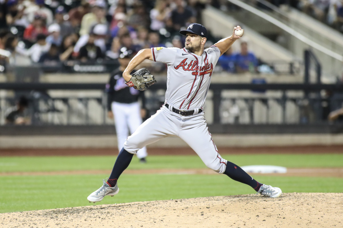 Aug 11, 2023; New York City, New York, USA; Atlanta Braves relief pitcher Brad Hand (45) pitches in the seventh inning against the New York Mets at Citi Field.