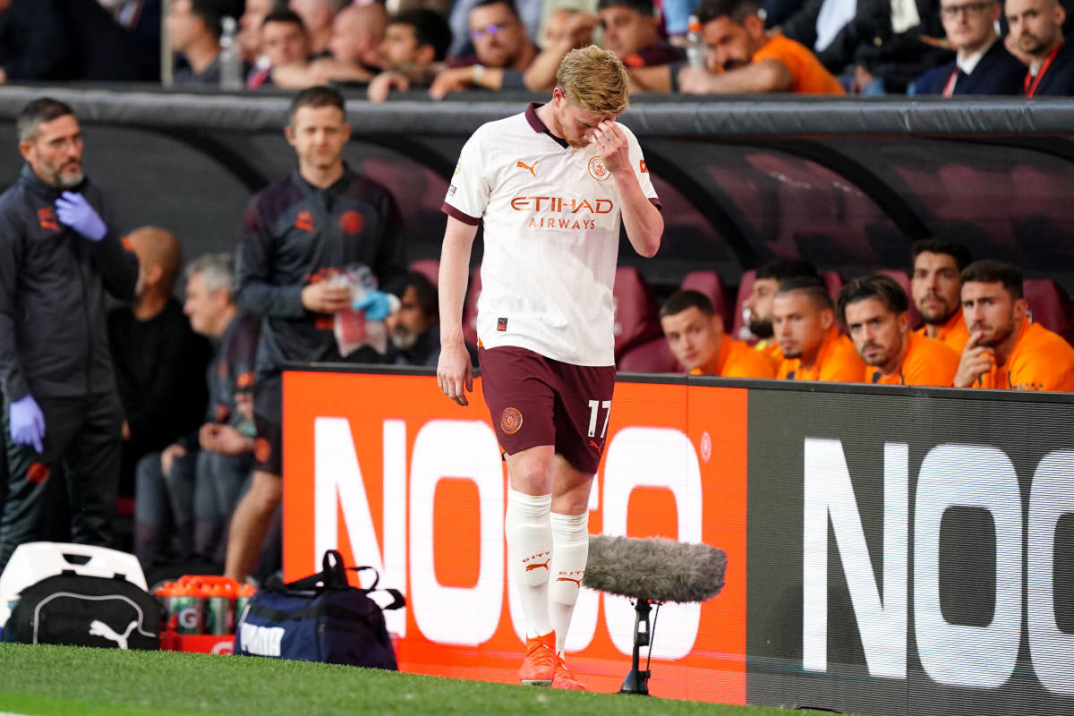 Manchester City midfielder Kevin De Bruyne pictured looking dejected after being forced off the field with an injury on the opening day of the 2023/24 Premier League season