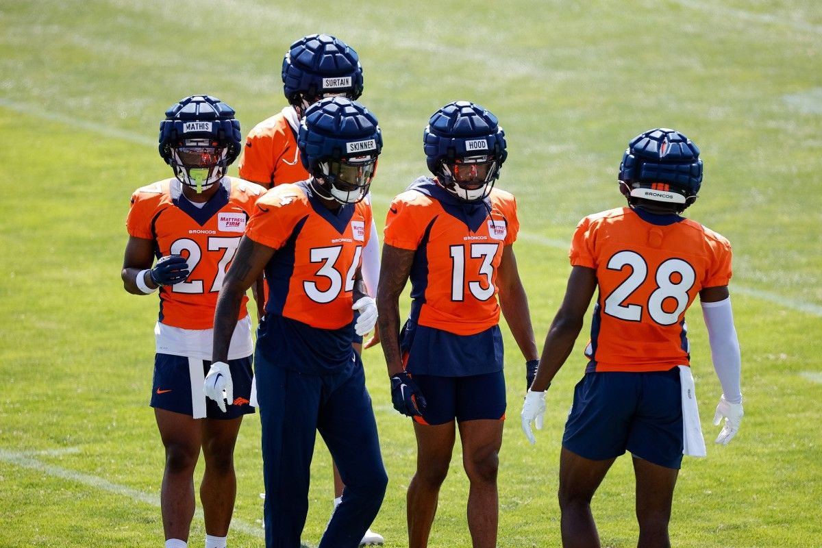 Denver Broncos cornerback Damarri Mathis (27) and safety JL Skinner (34) and cornerback Pat Surtain II (2) and cornerback Delonte Hood (13) and cornerback Art Green (28) during training camp at Centura Health Training Center.