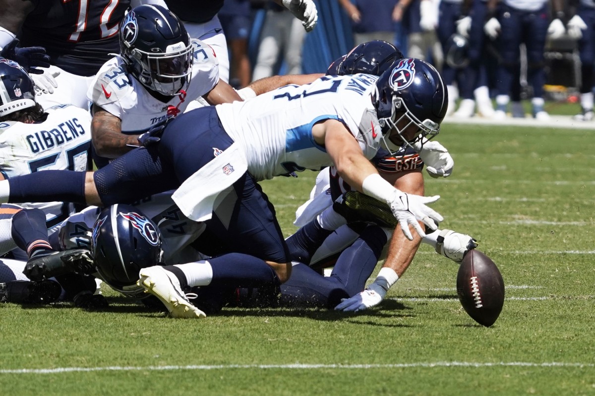 Tennessee Titans linebacker Ben Niemann (47) recovers a Chicago Bears fumble during the second quarter at Soldier Field. 