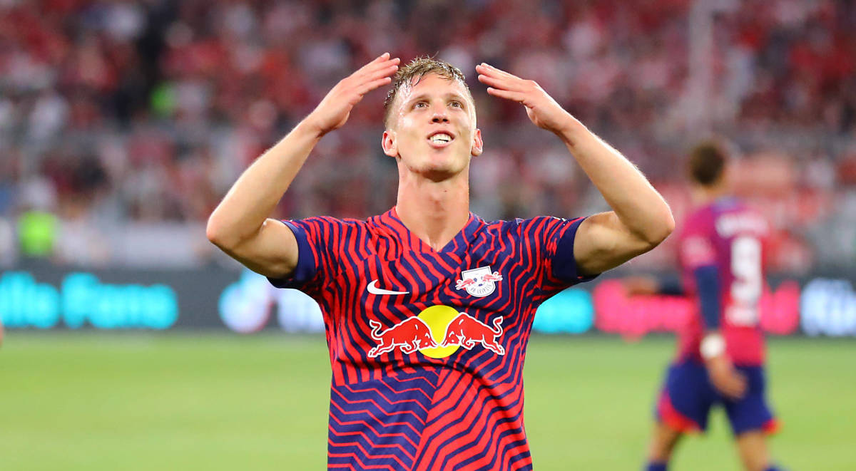 Dani Olmo pictured celebrating after scoring a hat-trick for RB Leipzig against Bayern Munich in the 2023 German Supercup final