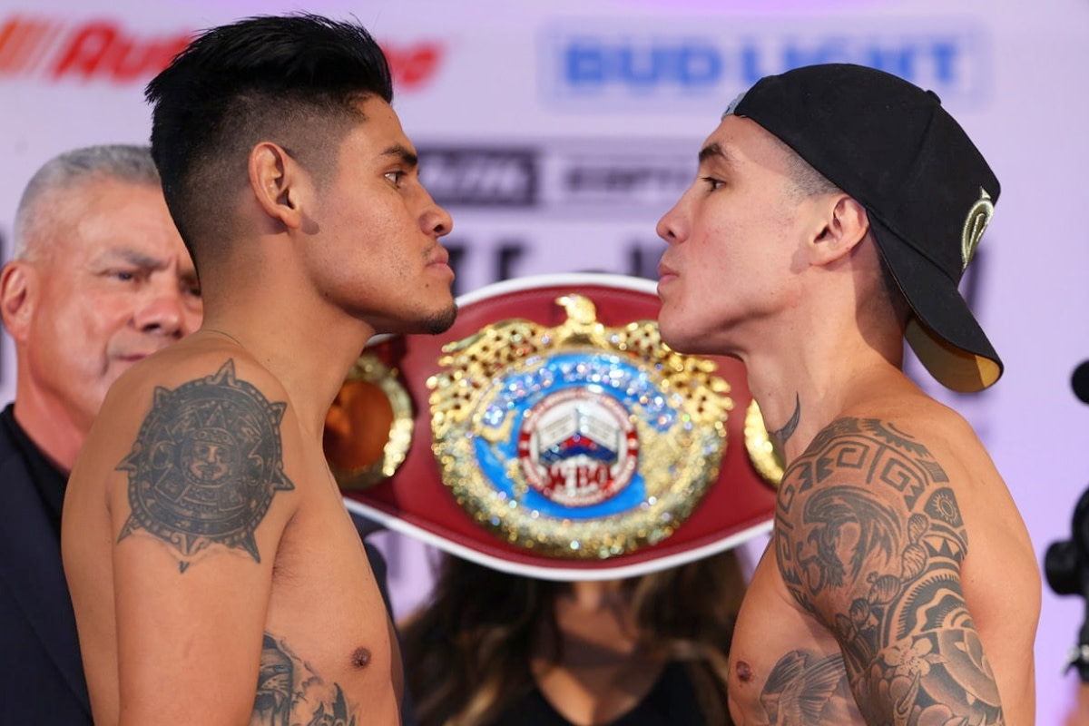 Emanuel Navarrete and Oscar Valdez stare down during the ceremonial weigh-ins for their WBO junior lightweight title fight.
