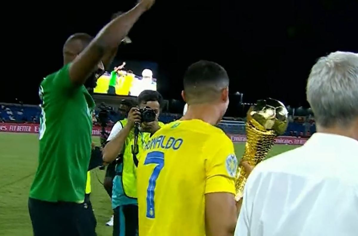 Cristiano Ronaldo pictured (center) holding the Arab Club Champions Cup trophy after his Al Nassr side beat Al-Hilal 2-1 in the 2023 final