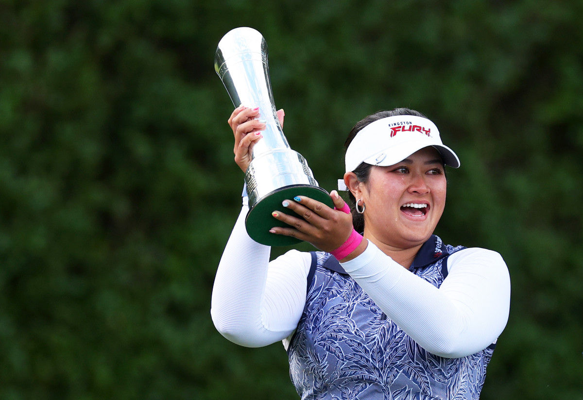 Lilia Vu of the United States lifts the AIG Women's Open Trophy on Day Four of the AIG Women's Open at Walton Heath Golf Club on August 13, 2023 in Tadworth, England.