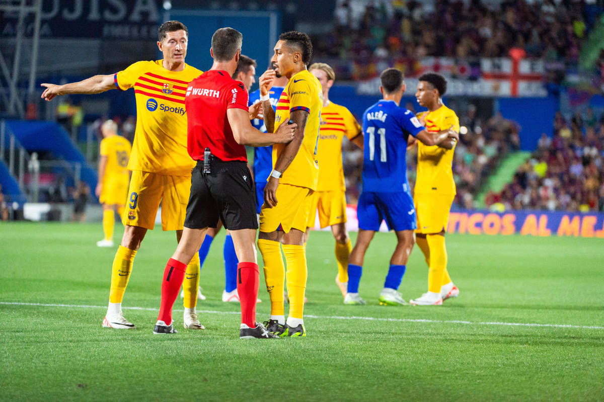Barcelona forward Raphinha pictured (center) arguing with referee Cesar Soto Grado during an away game at Getafe in August 2023