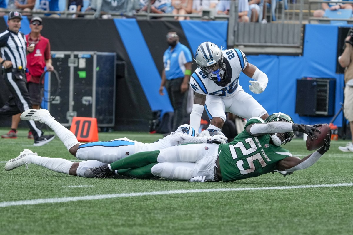 Jets' RB Israel Abanikanda reaches for the end zone on a 26-yard second-quarter run in Charlotte