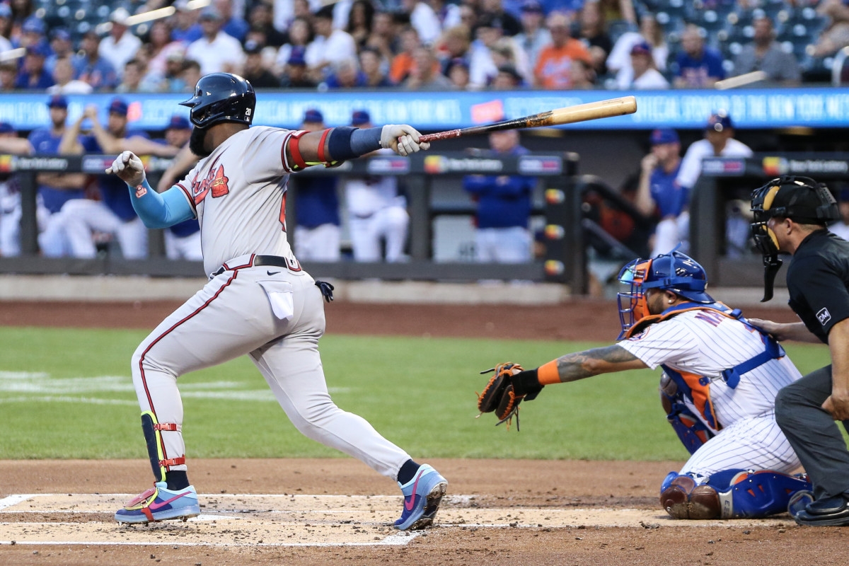 Aug 13, 2023; New York City, New York, USA; Atlanta Braves designated hitter Marcell Ozuna (20) hits a three run double in the first inning against the New York Mets at Citi Field.