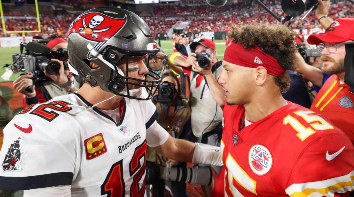 Former Buccaneers quarterback Tom Brady talks with Chiefs quarterback Patrick Mahomes after a game.