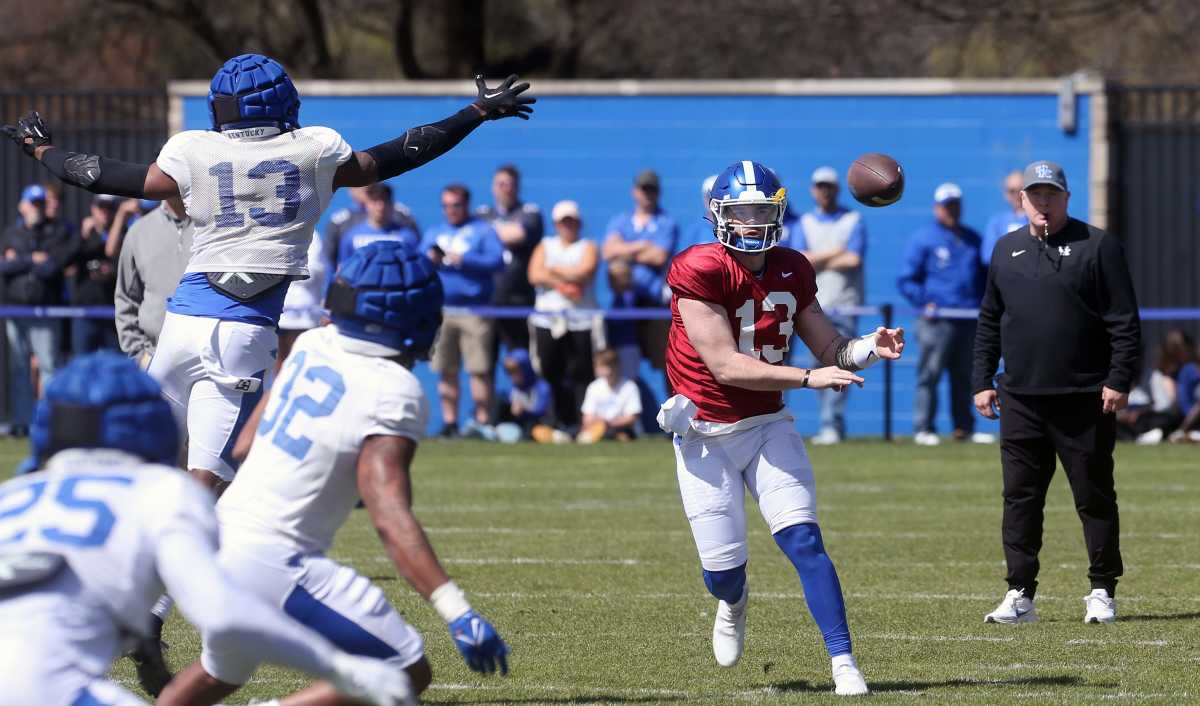 Kentucky s Devin Leary throws the ball past J.J. Weaver (#13) during open practice for the fans on Saturday.April 1, 2023 Kentuckypractice 03