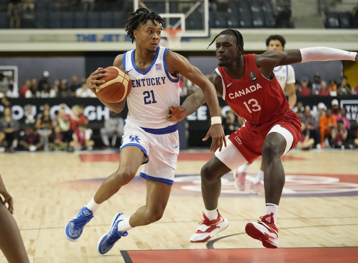 Jul 16, 2023; Toronto, Ontario, Canada; USA-Kentucky guard DJ Wagner (21) drives to the net against Canada center Enoch Boakye (13) during the first half of the Men's Gold game at Mattamy Athletic Centre. Mandatory Credit: John E. Sokolowski-USA TODAY Sports  