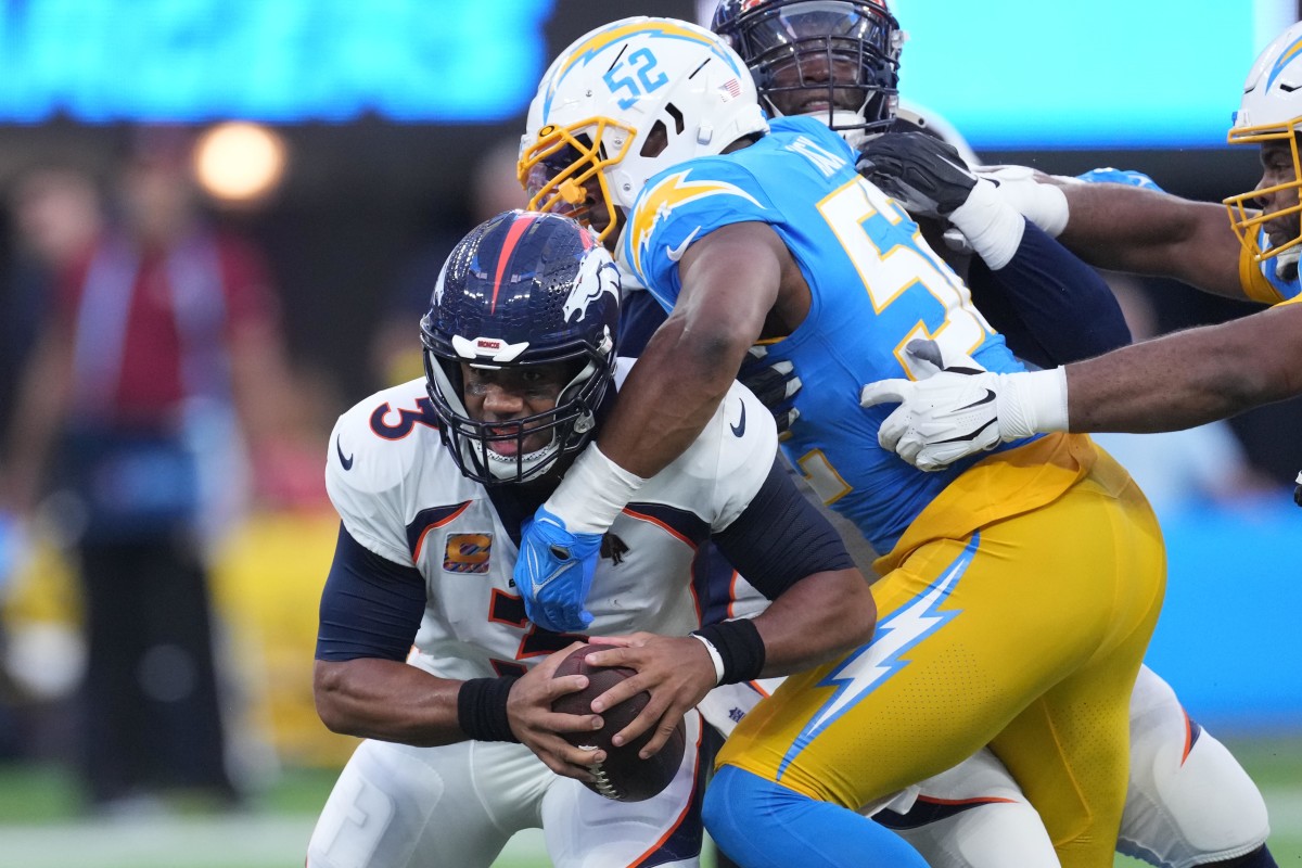 quarterback Russell Wilson is sacked by Los Angeles Chargers linebacker Khalil Mack