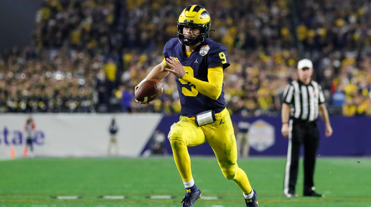Michigan quarterback J.J. McCarthy runs against TCU.