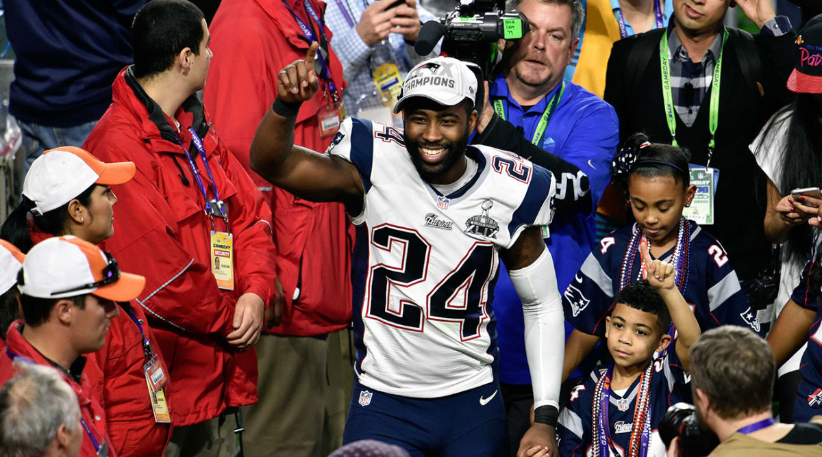 Darrelle Revis celebrates after winning the Super Bowl with the Patriots