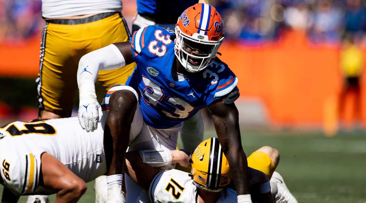 Florida defensive lineman Princely Umanmielen celebrates a sack