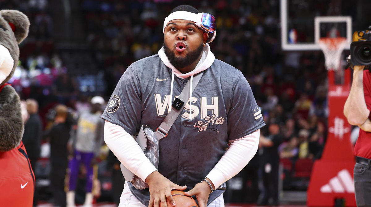 Comedian Druski takes a ceremonial free throw before an NBA game