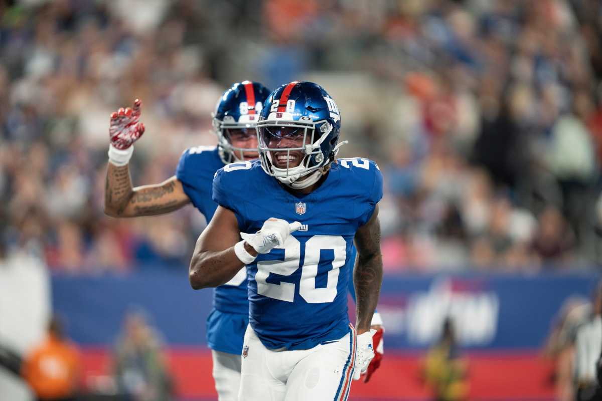 Aug 18, 2023; East Rutherford, NJ, USA; The Carolina Panthers vs. the New York Giants in an NFL preseason game at MetLife Stadium. New York Giants Eric Gray (20) celebrates after scoring touchdown in the second quarter