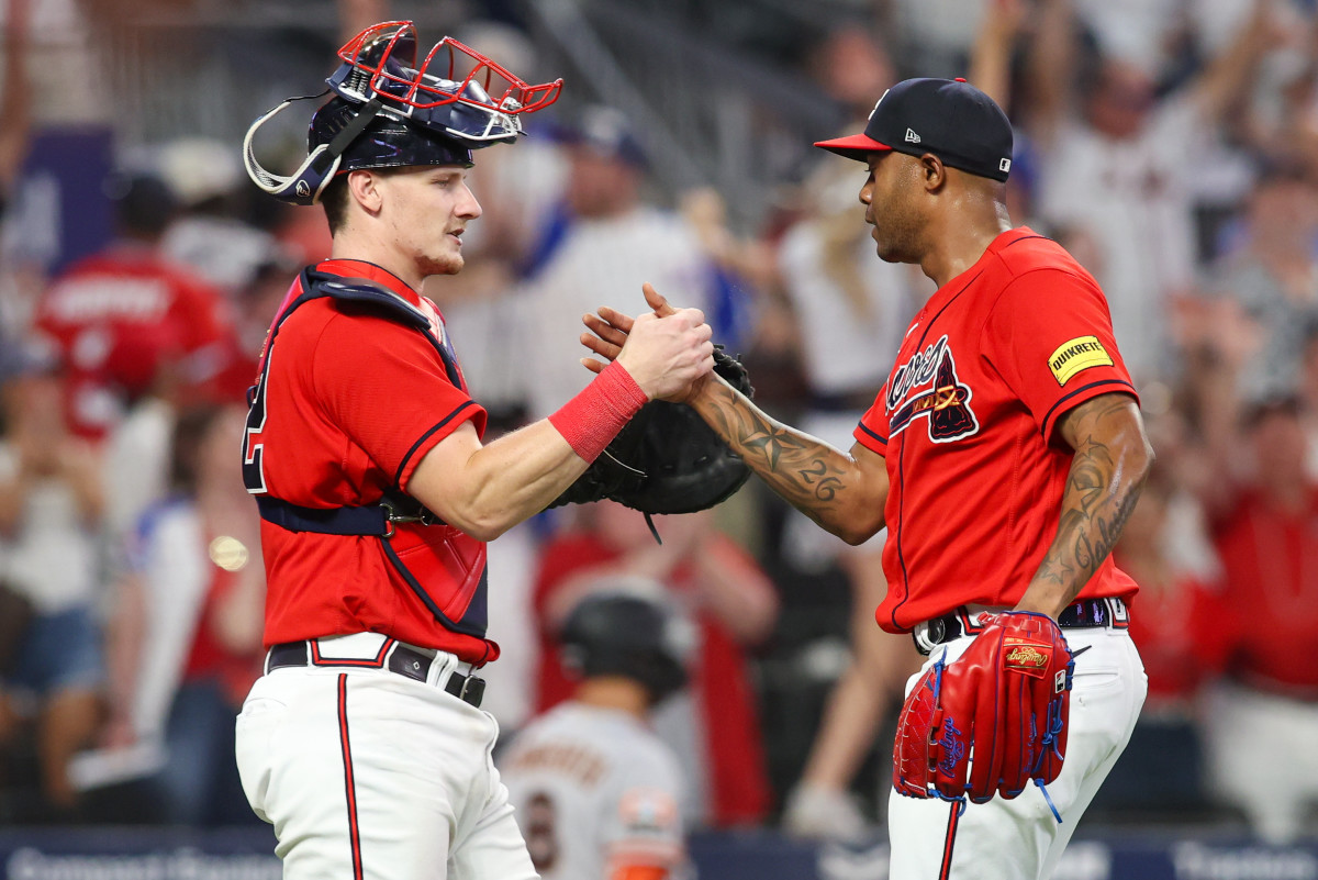 Aug 18, 2023; Atlanta, Georgia, USA; Atlanta Braves catcher Sean Murphy (12) and relief pitcher Raisel Iglesias (26) celebrate after a victory against the San Francisco Giants at Truist Park.