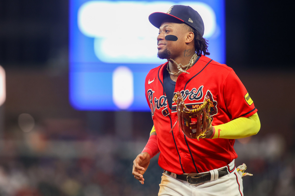 Aug 18, 2023; Atlanta, Georgia, USA; Atlanta Braves right fielder Ronald Acuna Jr. (13) runs to the dugout to change gloves against the San Francisco Giants in the ninth inning at Truist Park.