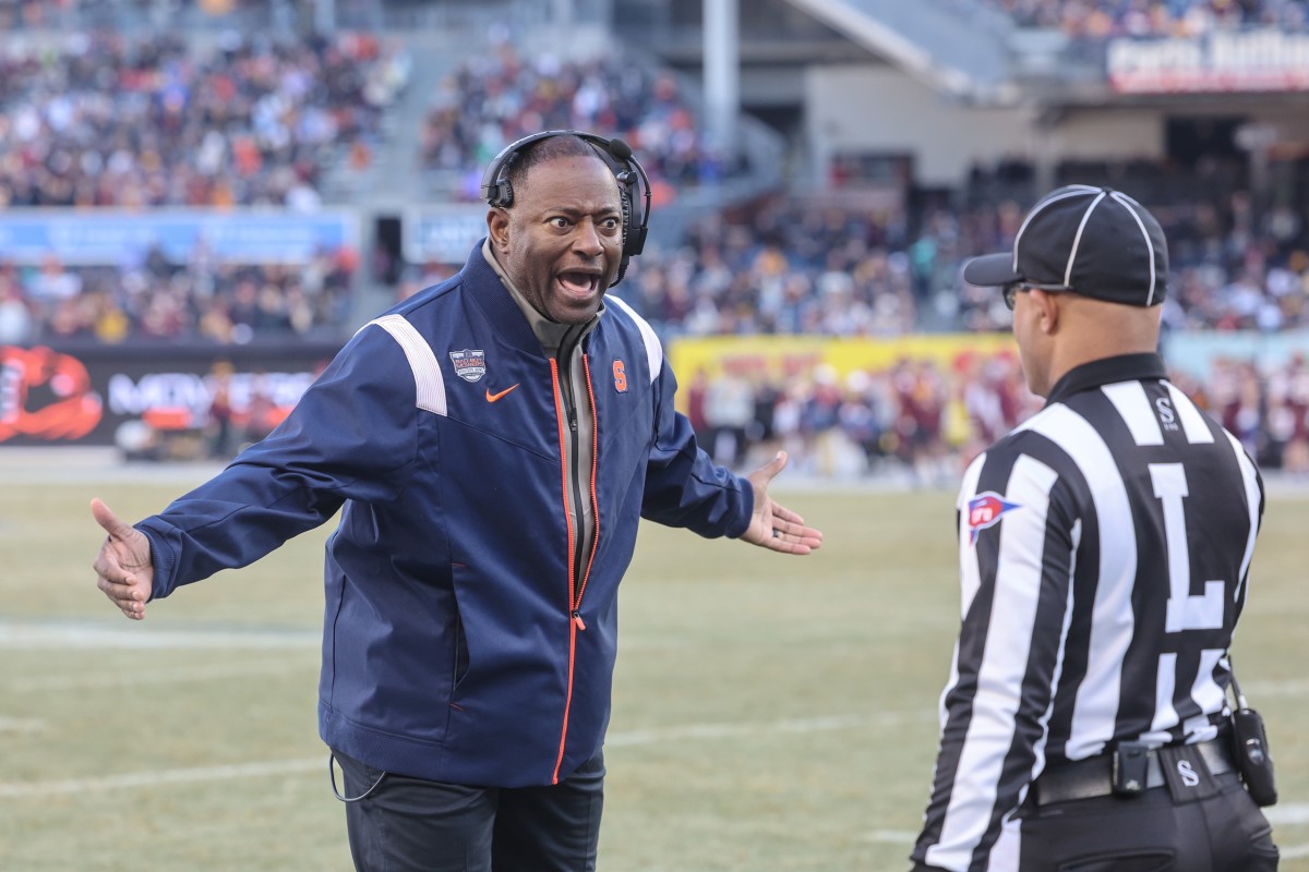 Syracuse Orange head coach Dino Babers argues with an official