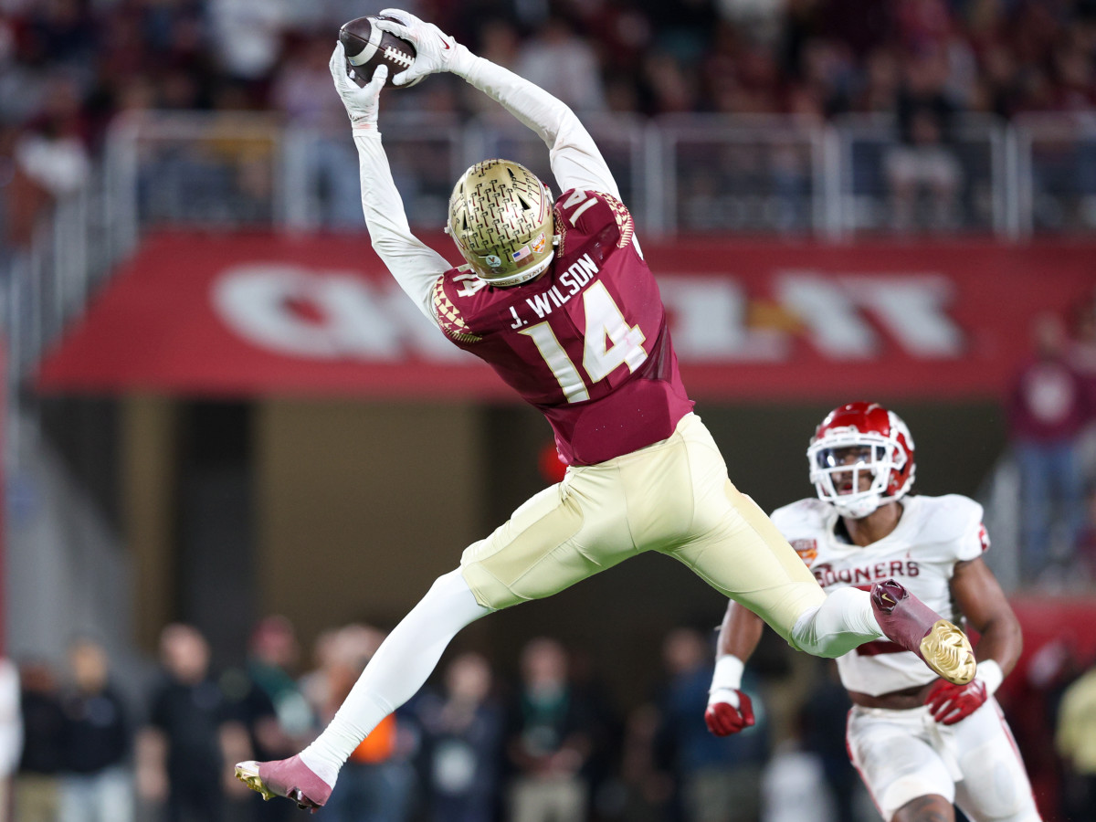 Dec 29, 2022; Orlando, Florida, USA; Florida State Seminoles wide receiver Johnny Wilson (14) makes a catch against the Oklahoma Sooners in the third quarter during the 2022 Cheez-It Bowl at Camping World Stadium. Mandatory Credit: Nathan Ray Seebeck-USA TODAY Sports