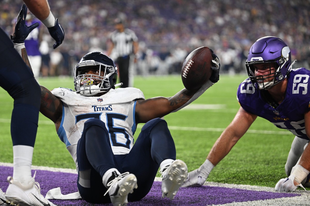 Tennessee Titans running back Julius Chestnut (36) reacts after scoring a touchdown as Minnesota Vikings linebacker Troy Reeder (59) looks on during the fourth quarter at U.S. Bank Stadium. 