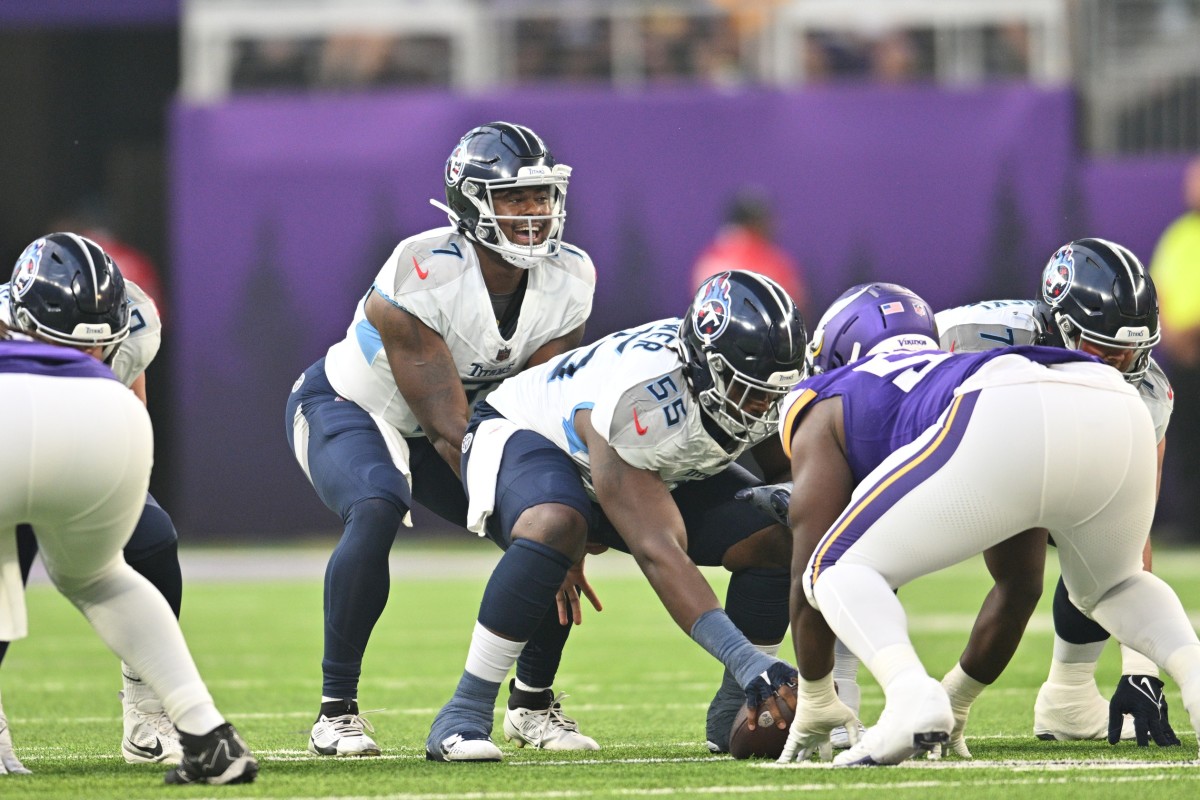 Tennessee Titans quarterback Malik Willis (7) and center Aaron Brewer (55) gets ready for the snap against the Minnesota Vikings during the first quarter at U.S. Bank Stadium.