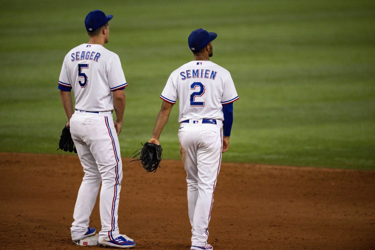 Texas Rangers shortstop Corey Seager, left, and second baseman Marcus Semien earned first-team All-MLB team honors after leading the club to its first World Series championship.