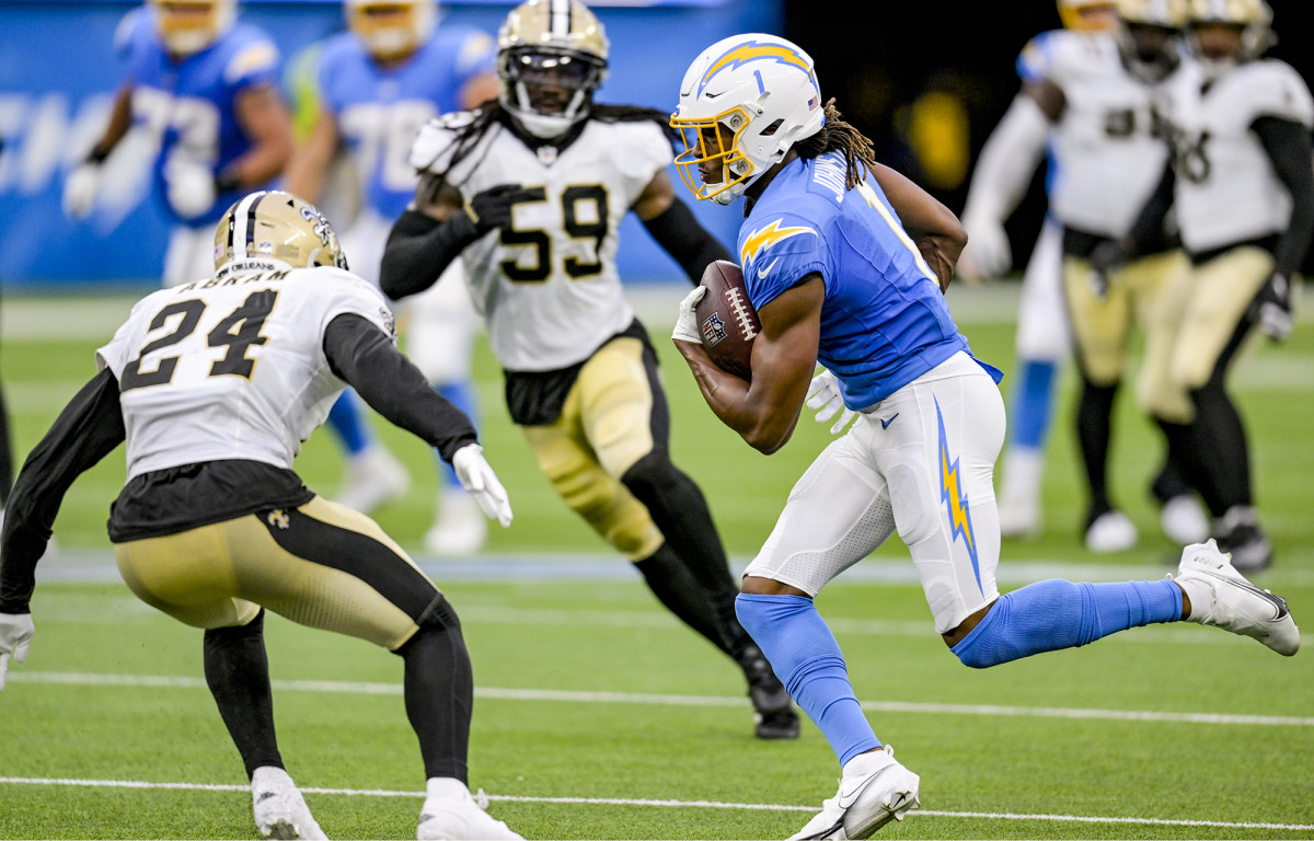 Quentin Johnston runs after a catch in a Chargers preseason game