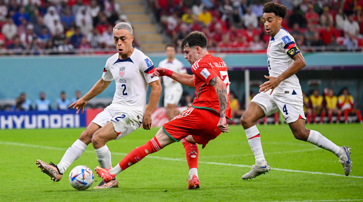 Sergino Dest and Tyler Adams playing for the U.S. at the World Cup.