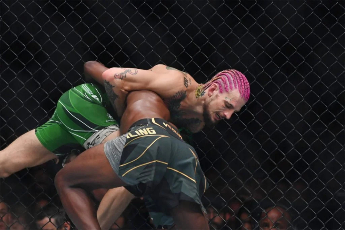 Sean O'Malley defends a takedown attempt from Aljamain Sterling in the UFC 292 main event.