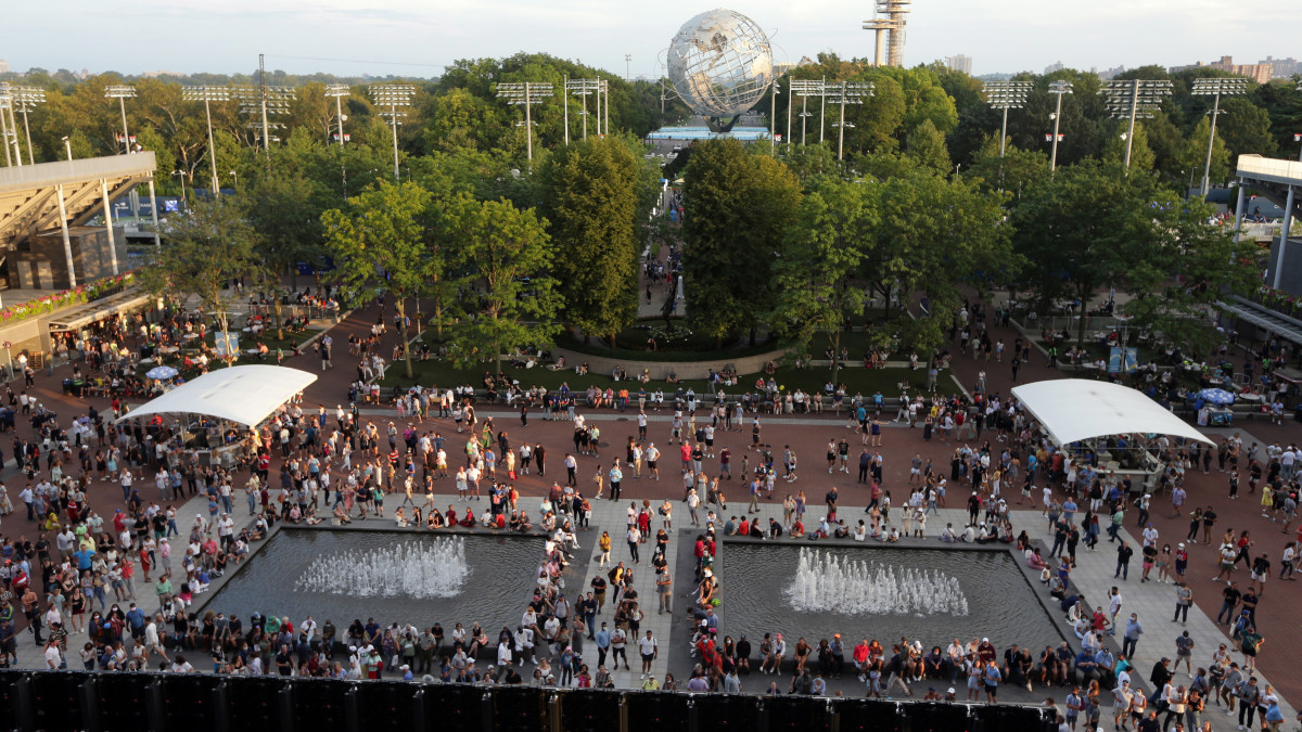 A crowd begins to gather outside to enter Arthur Ashe Stadium.