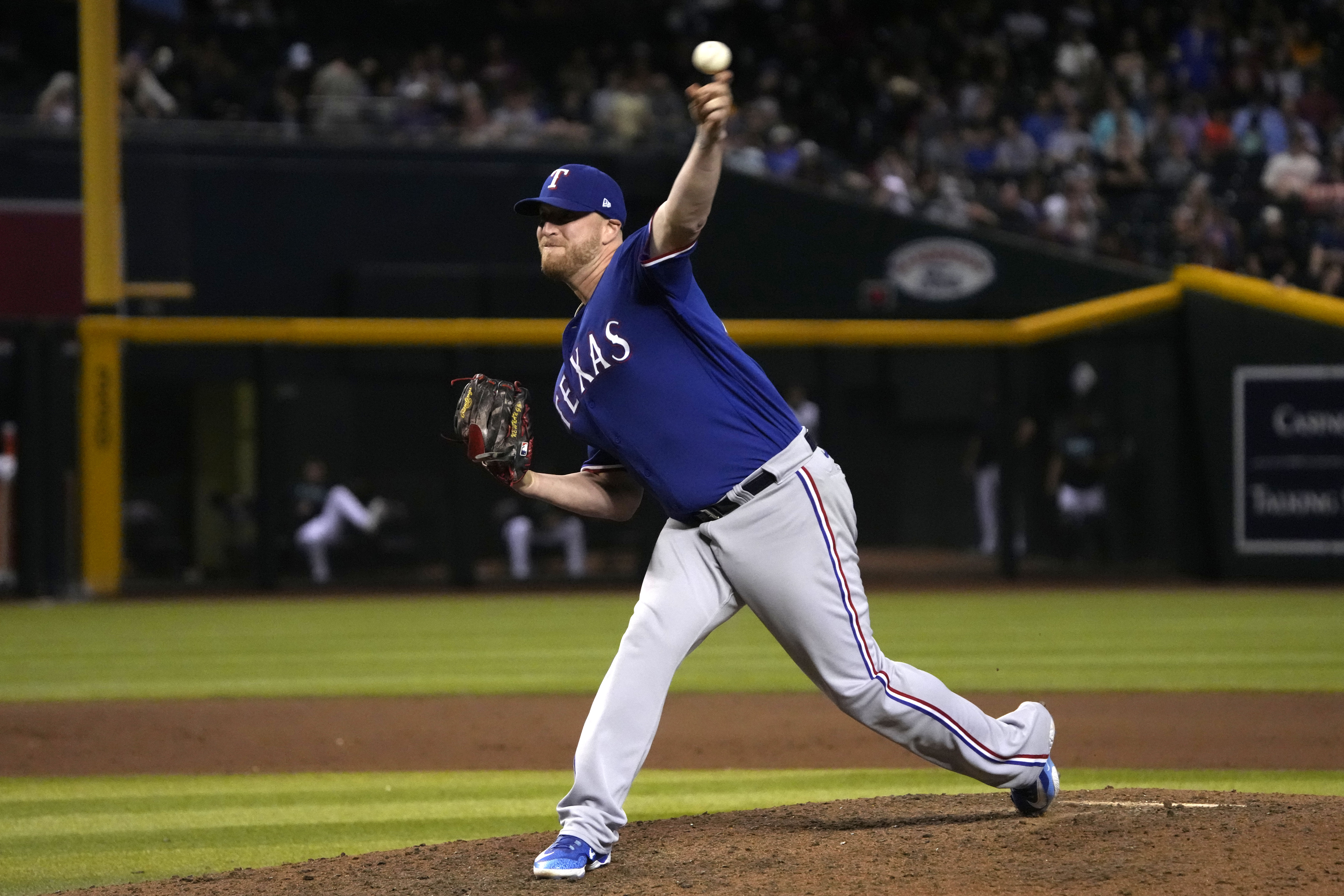 Aug 21, 2023; Phoenix, Arizona, USA; Texas Rangers relief pitcher Will Smith (51) throws against the Arizona Diamondbacks during the eleventh inning at Chase Field. Mandatory Credit: Rick Scuteri-USA TODAY Sports