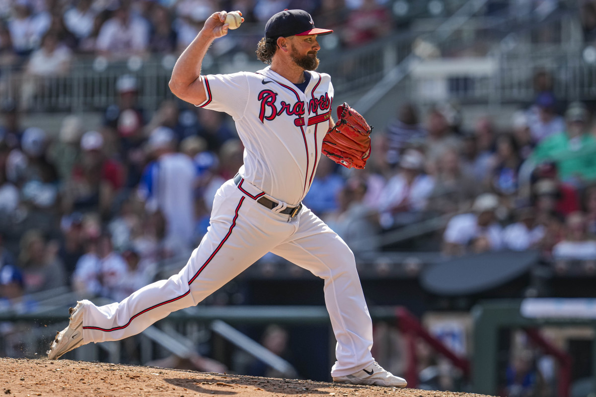 Aug 20, 2023; Cumberland, Georgia, USA; Atlanta Braves relief pitcher Kirby Yates (22) pitches against the San Francisco Giants during the ninth inning at Truist Park.