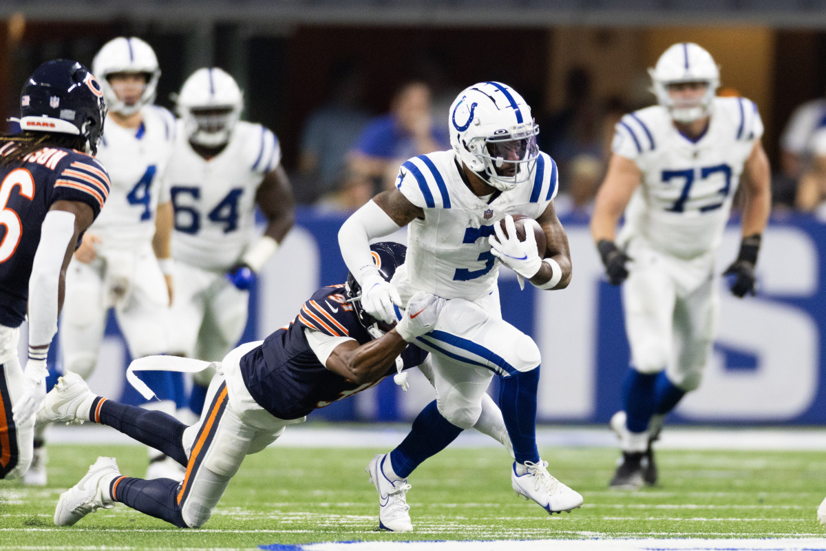 Aug 19, 2023; Indianapolis, Indiana, USA; Indianapolis Colts wide receiver Amari Rodgers (3) runs the ball while Chicago Bears defensive end Yannick Ngakoue (91) defends in the second half at Lucas Oil Stadium. Mandatory Credit: Trevor Ruszkowski-USA TODAY Sports