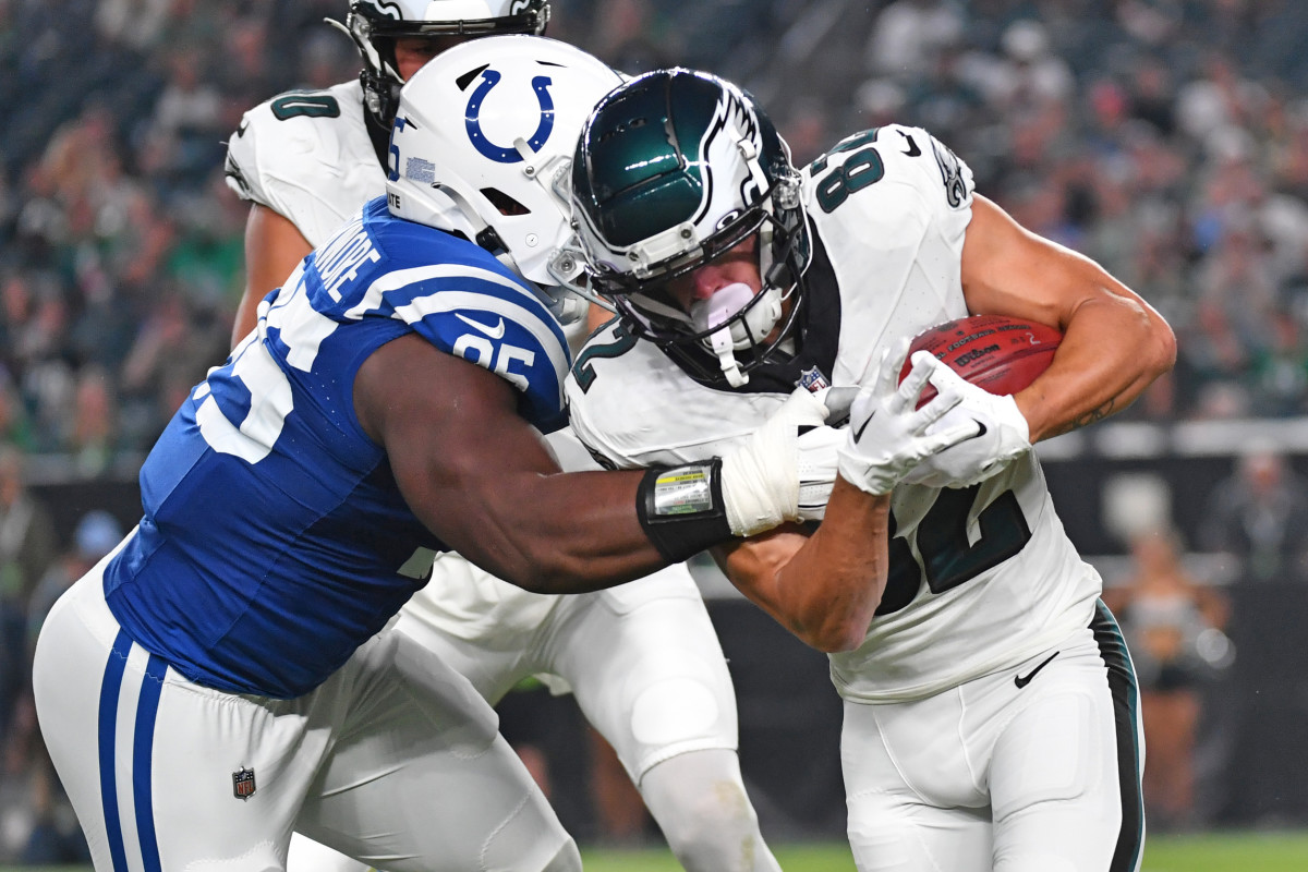 Aug 24, 2023; Philadelphia, Pennsylvania, USA; Philadelphia Eagles wide receiver Devon Allen (82) slips a tackle by Indianapolis Colts defensive end Adetomiwa Adebawore (95) as he returns the kick-off during the first quarter at Lincoln Financial Field.