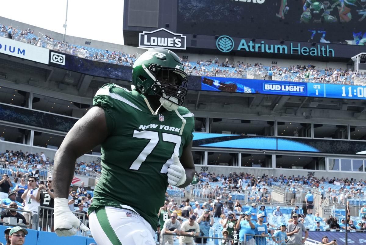 Jets' OT Mekhi Becton (77) enters the field for a NFL Preseason game against the Panthers