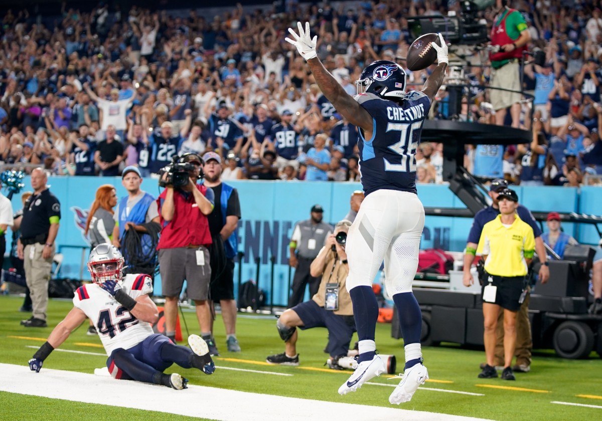 Tennessee Titans running back Julius Chestnut (36) celebrates a touchdown against the New England Patriots during the second quarter at Nissan Stadium.