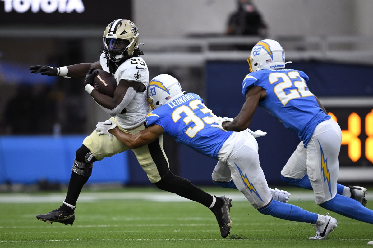 New Orleans Saints running back Kendre Miller (25) runs the ball against the Los Angeles Chargers. Mandatory Credit: Orlando Ramirez-USA TODAY
