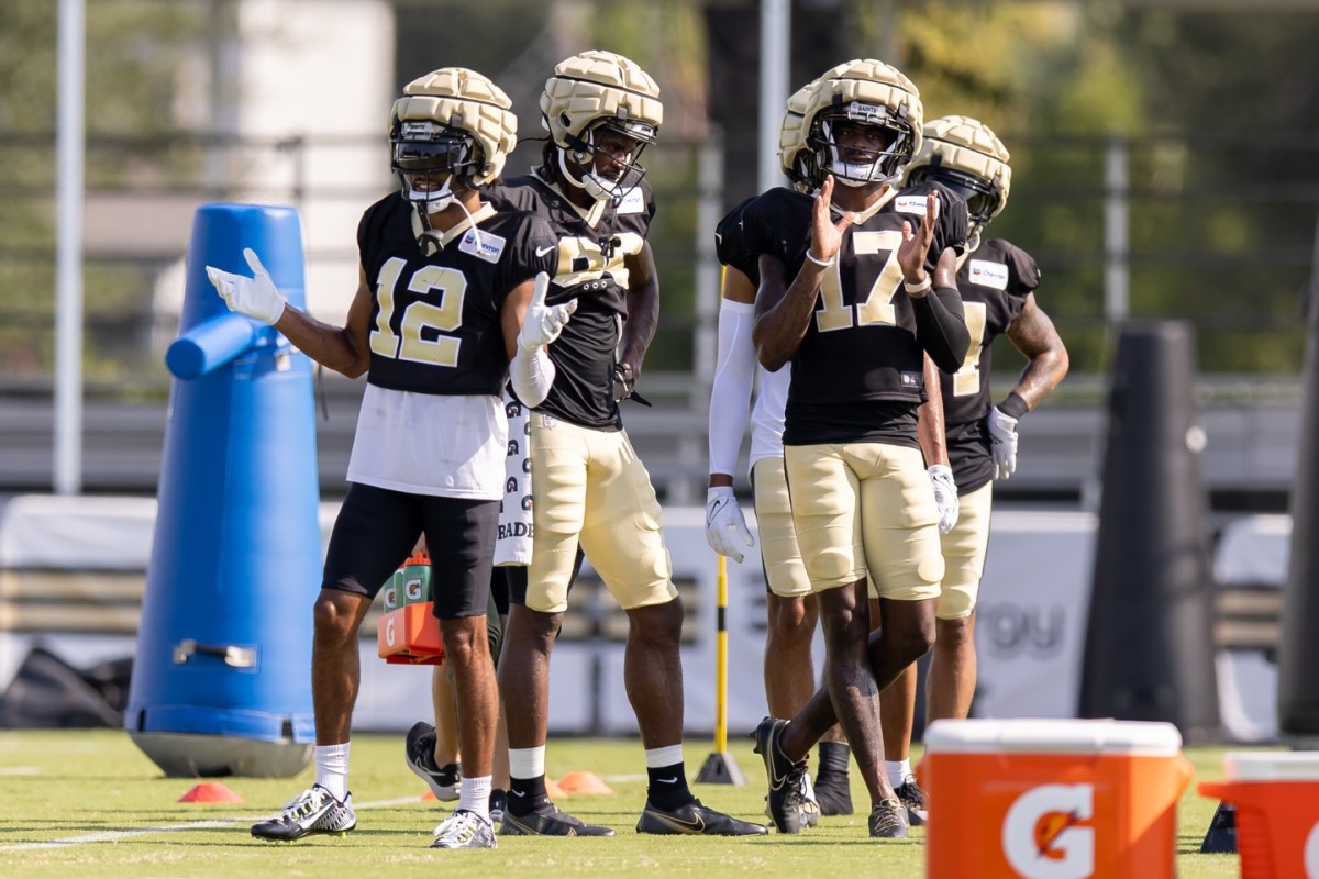 New Orleans Saints receivers Chris Olave (12) and wide receiver A.T. Perry (17) during training camp at the Ochsner Sports Performance Center. Mandatory Credit: Stephen Lew-USA TODAY