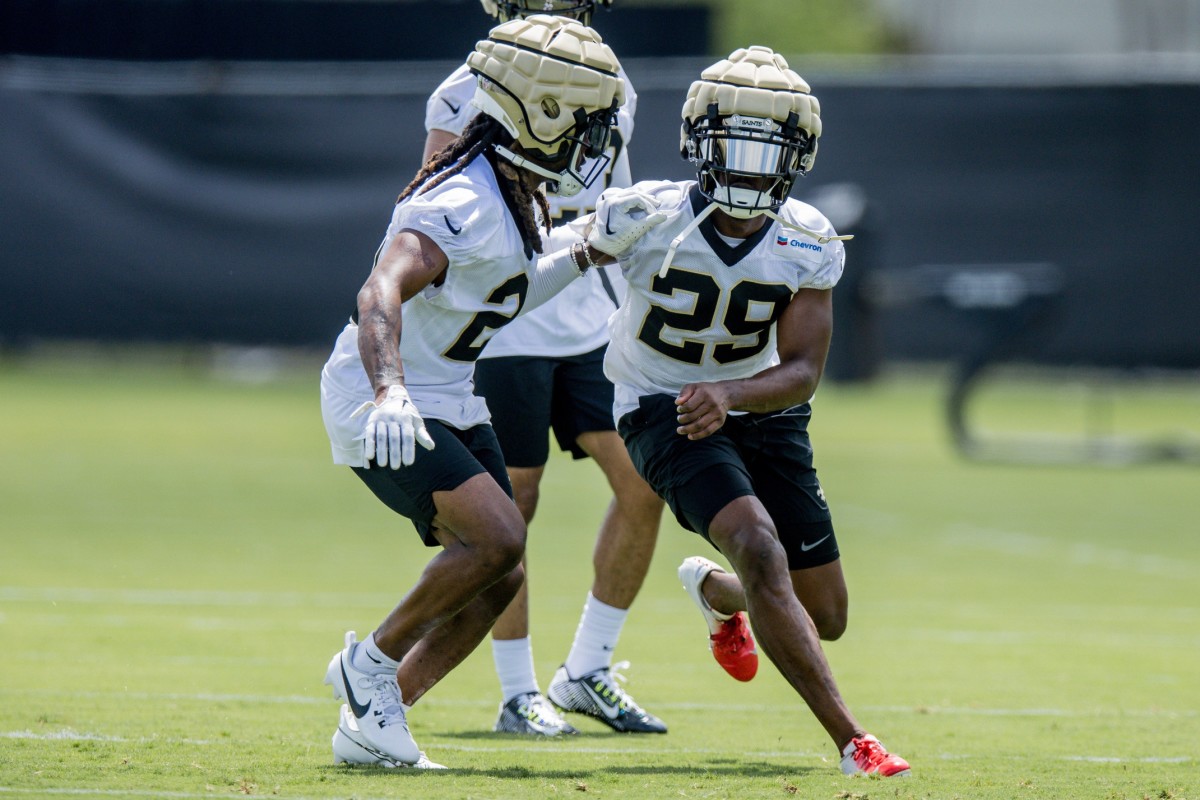 New Orleans Saints cornerbacks Paulson Adebo (29) and Bradley Roby (21) work on defensive back drills during minicamp at the Ochsner Sports Performance Center. Mandatory Credit: Stephen Lew-USA TODAY