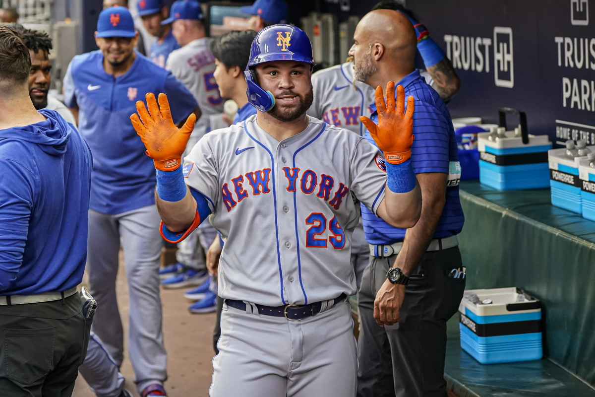 Aug 21, 2023; Cumberland, Georgia, USA; New York Mets right fielder DJ Stewart (29) reacts in the dugout after hitting a home run against the Atlanta Braves during the second inning at Truist Park.