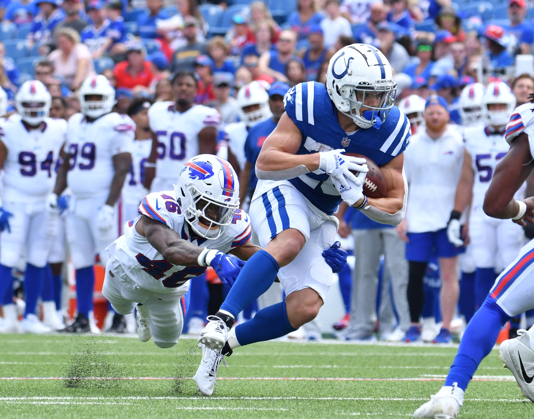 Aug 12, 2023; Orchard Park, New York, USA; Indianapolis Colts running back Evan Hull (26) breaks a tackle by Buffalo Bills cornerback Ja'Marcus Ingram (46) in the first quarter of a pre-season game at Highmark Stadium.