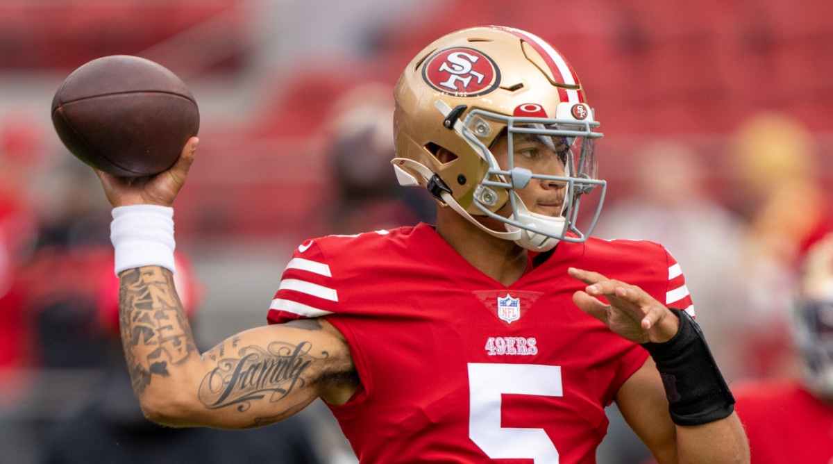 Former 49ers quarterback Trey Lance throws a ball during practice.